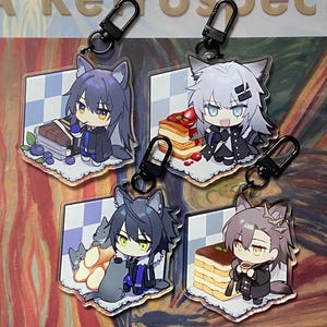 May include: Set of five acrylic keychains featuring anime-style wolf characters. Each keychain has a different character design, with various accessories like cake, blueberries, and coffee. The keychains have black metal clasps for easy attachment.