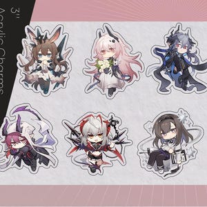 May include: Six 3-inch acrylic charms featuring anime-style characters. Each charm showcases a unique character design with detailed outfits and accessories. The charms are set against a pink and white background, with the text "Acrylic Charms" visible.