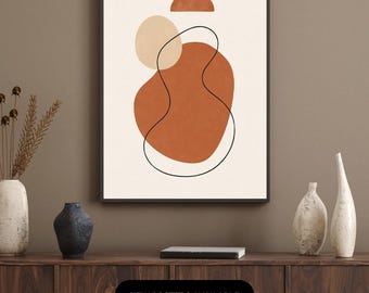 May include: Abstract art print in a black frame featuring terracotta and beige shapes with a black outline on an off-white background. The text "NEW POSTERS AVAILABLE" is displayed on a black bar.