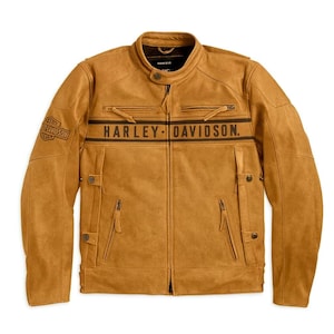 May include: A tan leather jacket with the words "HARLEY-DAVIDSON" printed across the chest. The jacket has a zip-up front, multiple pockets, and the Harley-Davidson logo on the left sleeve.