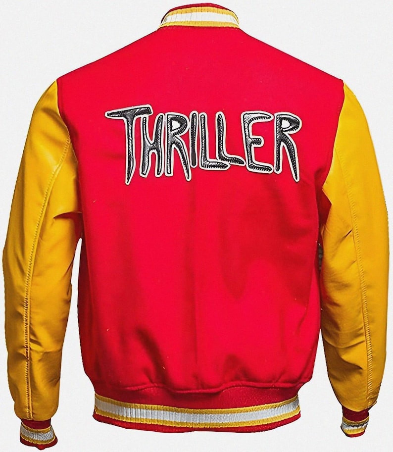 May include: Red and yellow varsity jacket with the word "THRILLER" in black and white lettering across the back. The jacket has yellow sleeves and a red body, with a striped collar and cuffs.