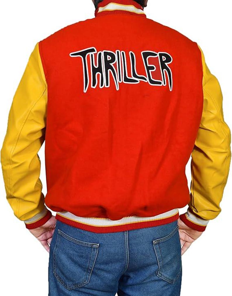 May include: Red and yellow varsity jacket with the word "THRILLER" in white lettering across the back. The jacket has yellow sleeves and a red body. The cuffs and collar are striped with white, red, and grey.