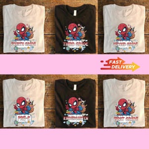 May include: A collection of six t-shirts in white and dark brown featuring a graphic of a cartoon superhero character with a backpack and school supplies. Each shirt displays different text including Pre-K, Kindergarten, First, Second, Third, and Fourth Grade.