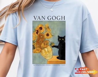 May include: Light blue t-shirt featuring a print of Van Gogh's "Sunflowers" painting with a black cat. The text "VAN GOGH" is above the image, and "SUNFLOWERS (THIRD VERSION) - 1888" is below. A "FAST DELIVERY" graphic is on the right.