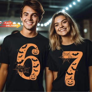 May include: Two black short-sleeved t-shirts featuring large orange graphic numbers. The left shirt displays the number 6 decorated with bats, a spider web, and jack-o'-lanterns. The right shirt displays the number 7 with bats and a spider web.