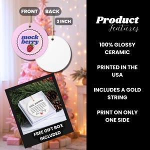May include: A round, pink ceramic ornament with the text "mock berry" and a raspberry illustration. The back is white. The ornament is 3 inches in diameter and includes a gold string for hanging. The product is printed in the USA.