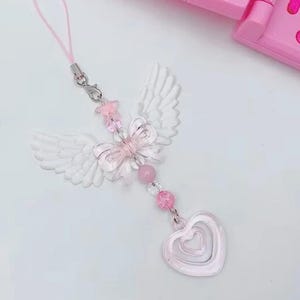 Charm avec noeud et coeur Ailes d'ange douces | Joli porte-clés avec bandoulière pour téléphone pour fille et femme