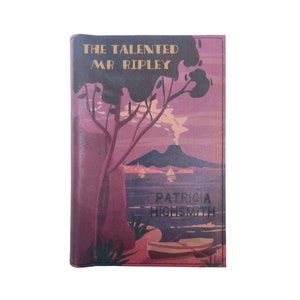 May include: A vintage-style book cover with a purple background featuring a tree, a mountain, and a boat in the water. The title "The Talented Mr. Ripley" is printed in gold lettering. The author's name, "Patricia Highsmith", is printed in black lettering.