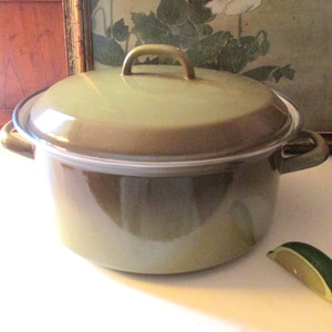 May include: A set of three ceramic mugs with a speckled, matte finish. The mugs are in shades of cream, light brown, and dark brown. Each mug has a simple, minimalist design, perfect for coffee or tea.