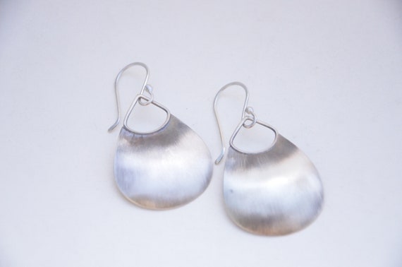 Silver domed earrings in purse like shape