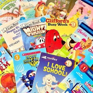 May include: A collection of children's books with colorful covers. Titles include "Paddington Sets Sail," "Clifford's Busy Week," and "I Love School!" The books are designed for early readers and feature various characters and themes.