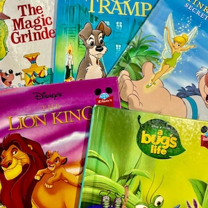 May include: A collection of Disney storybooks featuring titles like "The Lion King," "Lady and the Tramp," and "A Bug's Life." The books have colorful covers with illustrations of characters from the movies. The books are stacked together.