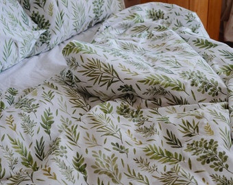 Ensemble de linge de lit. Housse de couette et taies d'oreiller en satin de coton. Impression de motif botanique. Literie en coton. Linge de lit à imprimé floral.