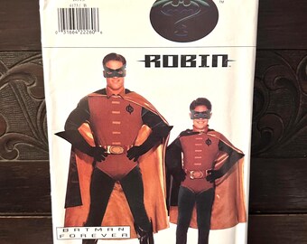 May include: A Butterick sewing pattern for a Robin costume from the movie Batman Forever. The package features illustrations of the costume, including a red and black bodysuit, cape, and mask. The package also includes the text "ROBIN".