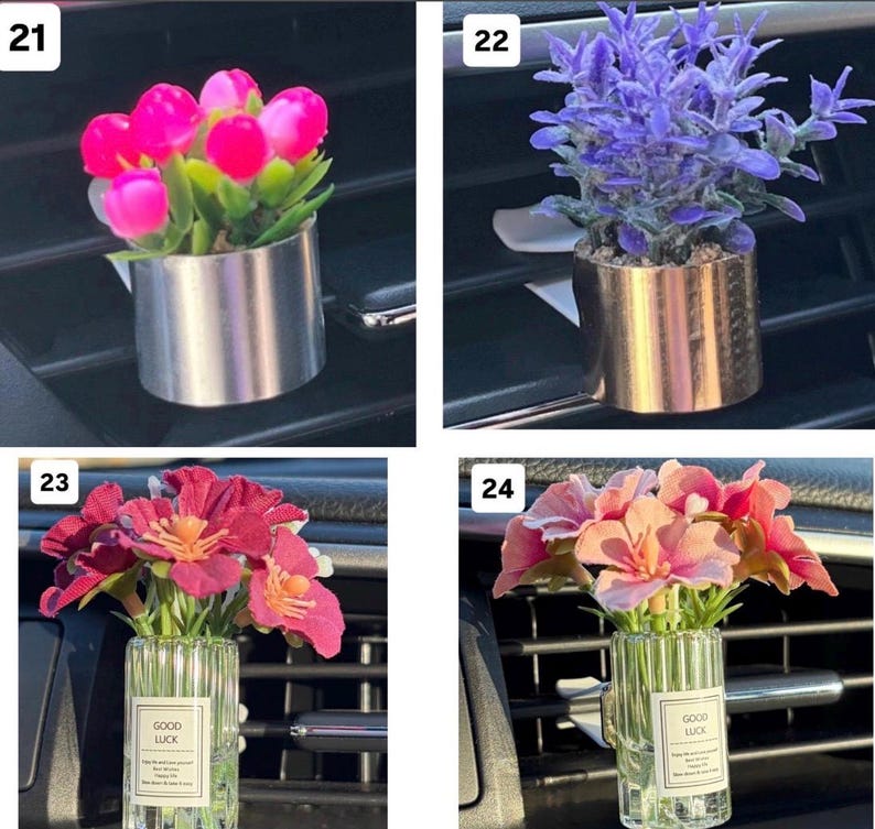 May include: A collection of four car air vent decorations. The first features pink tulips in a silver metal pot. The second has purple flowers in a gold pot. The third and fourth have flowers in a glass vase with "GOOD LUCK" text.