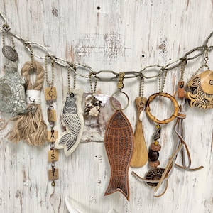 May include: A set of three ceramic mugs with a speckled, matte finish. The mugs are in shades of cream, light gray, and dark gray. Each mug has a simple, minimalist design, perfect for coffee or tea.