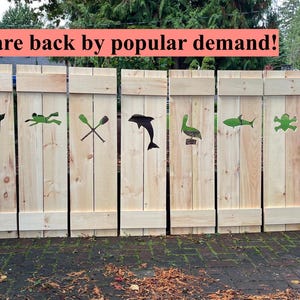 May include: Wooden shutters with cut-out designs of marine life and objects, including a turtle, whale, swimmer, crossed oars, dolphin, pelican, shark, frog, lighthouse, and whale tail. The text "Shutters are back by popular demand!" is displayed above.