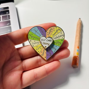 Self Care Spinner Enamel Pin: Heart with Wellness Activities