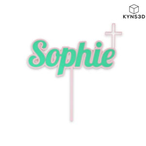 以下が含まれることがあります： ピンクとグリーンのケーキトッパー。筆記体で「Sophie」と書かれています。名前は緑色でピンクの縁取り。右側に十字架があります。トッパーはピンクのスティックに取り付けられています。