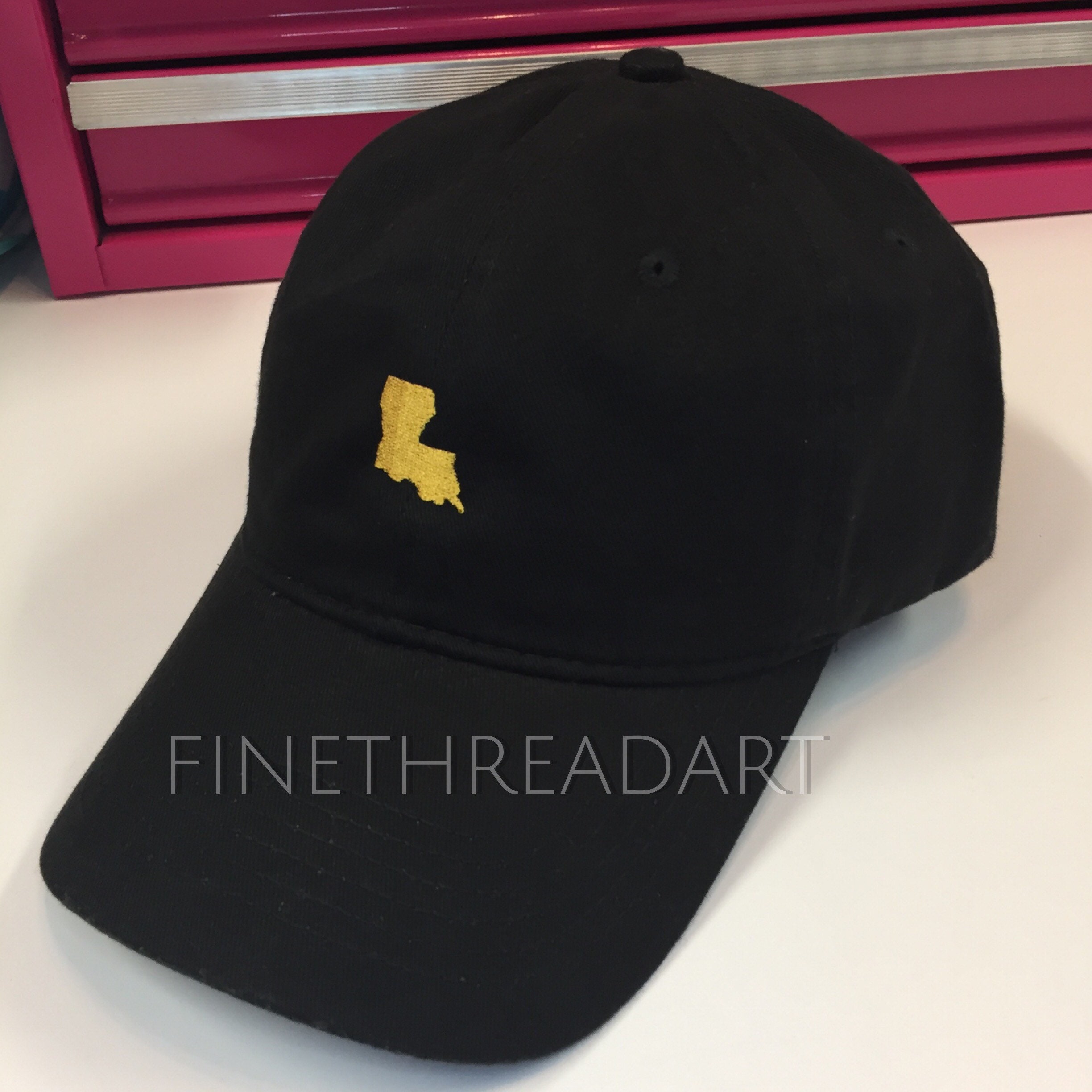 black and gold la hat