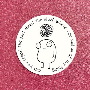 May include: A white sticker with a cartoon figure and the text "Can you repeat the part about the stuff where you said all of the things" in a circular design. The background is a sparkly pink.