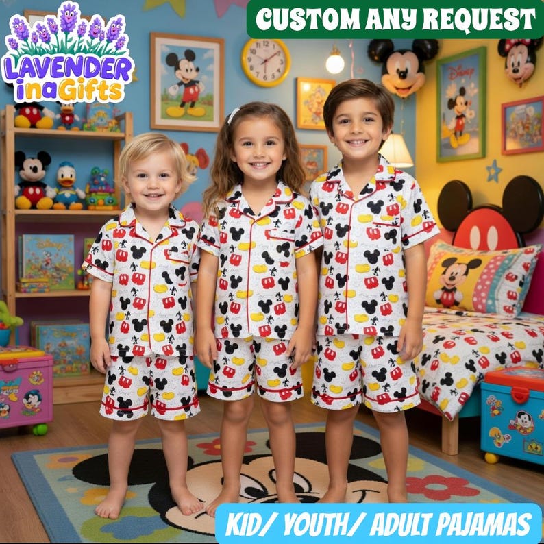 Three children wearing Mickey Mouse-themed pajamas stand together in a room decorated with Disney-themed decorations.