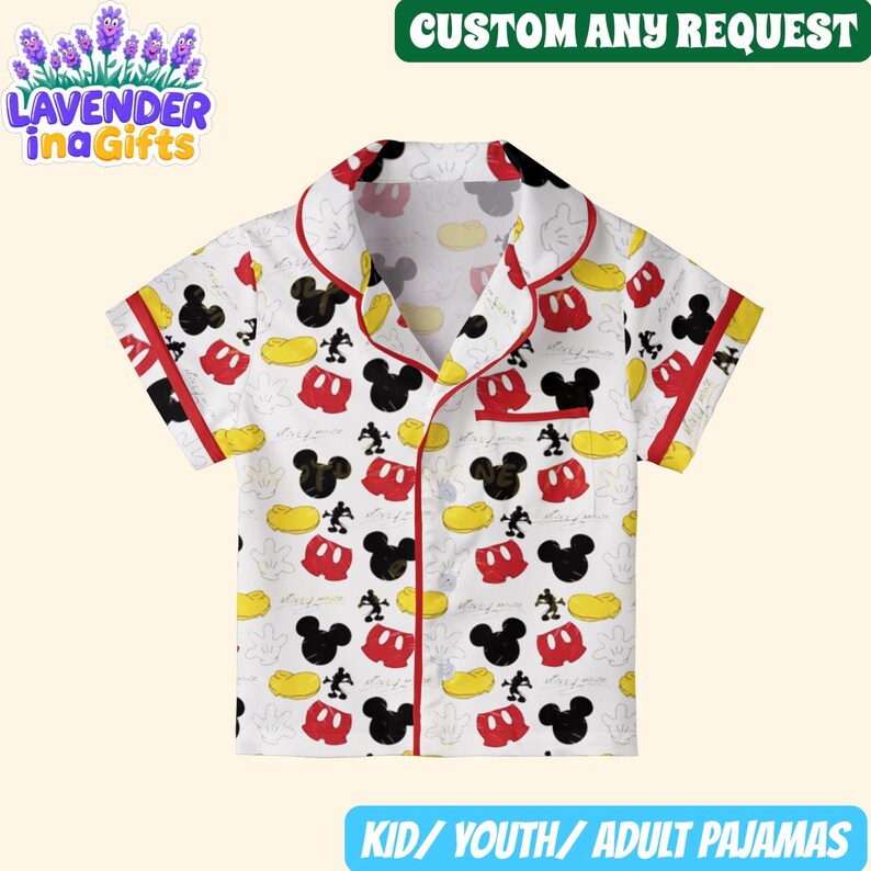A white pajama shirt with a Mickey Mouse pattern printed on it.
