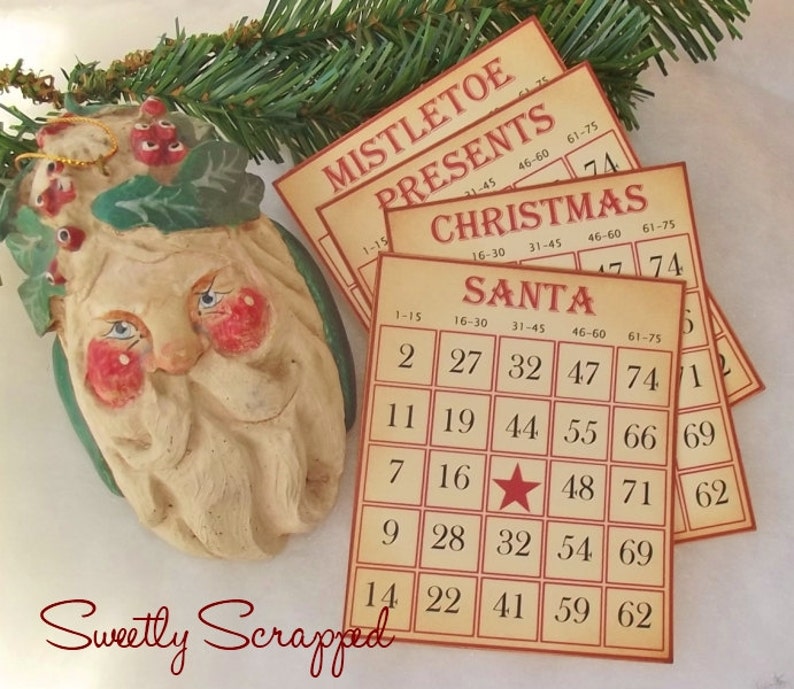 May include: A set of four vintage-style Christmas bingo cards with the words "Mistletoe", "Presents", "Christmas", and "Santa" printed on them. Each card has a grid of numbers with a red star in the center of the "Santa" card.