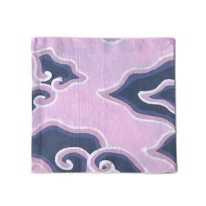 May include: Square pink fabric with a repeating pattern of dark blue and white cloud-like shapes. The fabric has a soft, textured appearance. The design is reminiscent of a batik or hand-painted style.