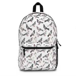 May include: White backpack featuring a repeating pattern of gray and purple pigeons. The backpack has a black top handle, black zippers, and a black mesh side pocket. The design is whimsical and suitable for carrying books or personal items.