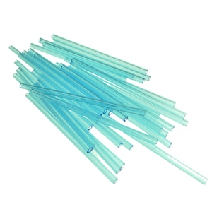 May include: A pile of transparent, pale blue plastic tubes, arranged against a white backdrop. The tubes are cylindrical and seem hollow, with a uniform diameter. The lighting accentuates their smooth, shiny surfaces.