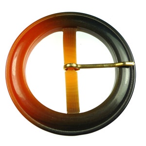 Old dark brown and orange plastic belt buckles
