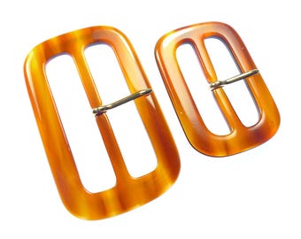 Old brown plastic belt buckles