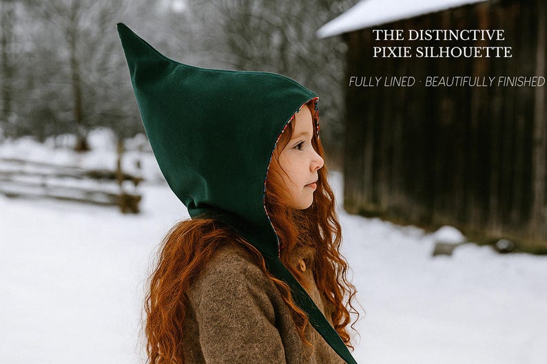 May include: A dark green pointed hood with a patterned lining. The text on the image reads: THE DISTINCTIVE PIXIE SILHOUETTE, FULLY LINED, BEAUTIFULLY FINISHED. The hood features a tall, structured peak and covers the head, extending down the neck.