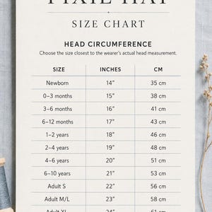 May include: A white informational size chart for a Pixie Hat by Cheri Demeter Patterns. The chart lists head circumference measurements in inches and centimeters for sizes ranging from newborn to adult XL, with instructions to measure above the eyebrows.