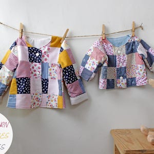 May include: Two long-sleeved jackets made of patchwork fabric with various floral, striped, and solid-colored squares in pink, yellow, blue, and white. Each jacket features a round neckline, three white buttons, and cuffs. Text reads: PDF PATTERN +40 PICTURES +20 PAGES.
