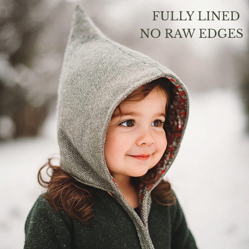 May include: A grey pointed hood with a textured exterior and a floral patterned lining. The hood features a seam running down the center and is fully lined with no raw edges, as indicated by the text overlay: FULLY LINED NO RAW EDGES.