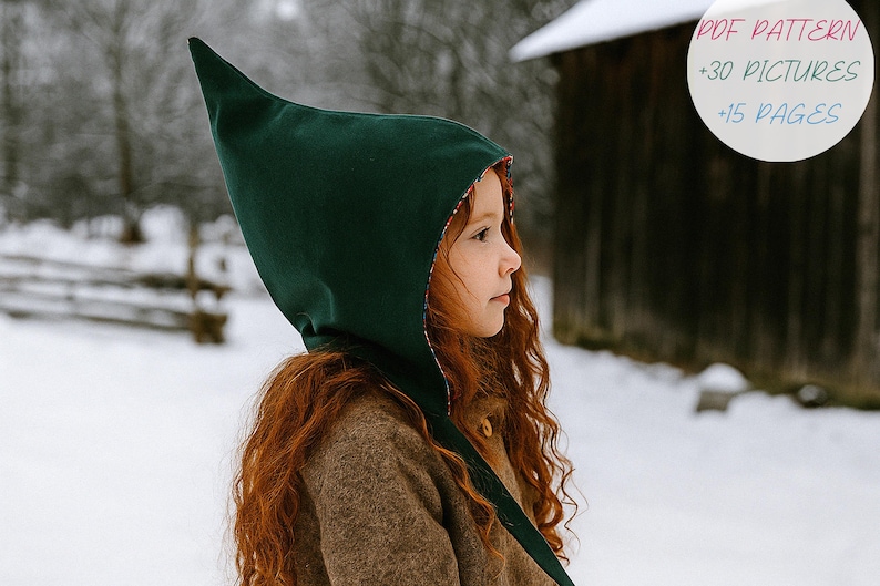May include: A child wearing a dark green pointed hood with a red patterned lining. The hood is part of a brown coat. The image includes text that reads "PDF PATTERN +30 PICTURES +15 PAGES". The background is a snowy outdoor scene.