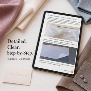 May include: A digital tablet displays a sewing tutorial with text and two instructional photos. The screen shows steps for fusing interlining to fabric. Beside the tablet are folded pieces of pink, cream, and gray fabric, two buttons, and a small card.