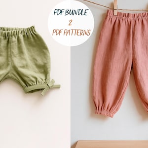May include: Two pairs of baby pants in soft, muted colors. One pair is olive green with bow details, and the other is a dusty rose color. The text "PDF BUNDLE 2 PDF PATTERNS" is in a white circle.
