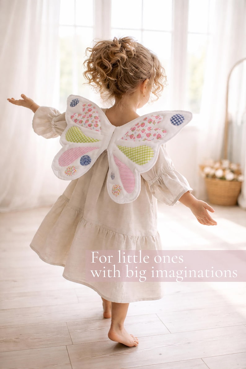 May include: Fabric butterfly wings featuring a white base with colorful patchwork sections in pink, green, and blue floral and gingham patterns. The wings are worn over a beige dress. Text on the image reads: For little ones with big imaginations.