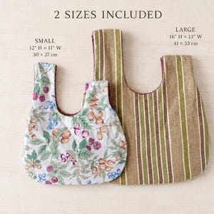 May include: Two fabric bags with 2 SIZES INCLUDED text. The small bag measures 12 inches H by 11 inches W and features a white background with a colorful berry and nut pattern. The large bag measures 16 inches H by 13 inches W with brown and green stripes.