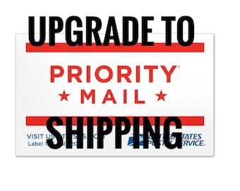 May include: Upgrade to Priority Mail Shipping. A white label with red and blue accents. The text "Upgrade to Priority Mail Shipping" is in black. The text "Priority Mail" is in red with a star on either side. The text "Visit us at USPS.com" is in blue.