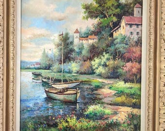 Vintage Framed Oil Painting by W. Eddie – Boats on Riverbank with European Village