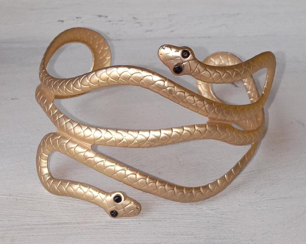 Gold metal Snake  bracelet with black stone eyes--1990s