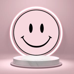 May include: A pink smiley face with black eyes and a curved mouth, set against a pink background. The smiley face is surrounded by a white neon light. The design is displayed on a white marble-patterned pedestal.