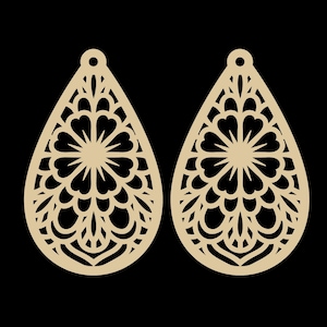 May include: Two beige teardrop-shaped earrings with intricate floral cut-out designs. Each earring features a central circular pattern surrounded by heart-shaped elements and delicate, curved lines. The earrings have a small hole at the top for attachment.