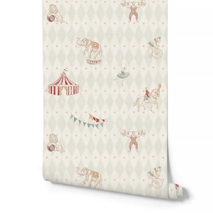 May include: Wallpaper roll with a circus theme. The design features repeating illustrations of circus animals and performers, including elephants, lions, a strongman, a ballerina, and a bear on a bicycle, set against a diamond pattern background.