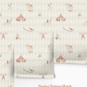 May include: Wallpaper roll with a circus-themed pattern. The design features circus tents, elephants, strongmen, acrobats, and other circus elements in a repeating pattern on a light background. The text "Perfect Pattern Match" is visible.