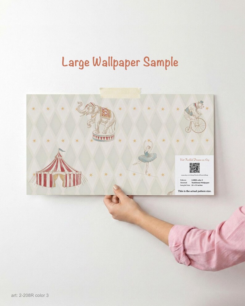 May include: A large wallpaper sample with a circus theme. The design includes an elephant on a pedestal, a bear riding a bicycle, a circus tent, and a ballerina. The background is a light green diamond pattern with gold stars. The sample is 76 x 48 cm.